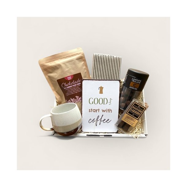 Kaffekurv med krus, servietter, skilt og godter