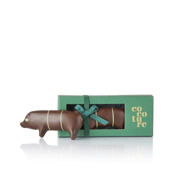 Ca. 80g. marcipangris med pistacie, m�rk chokolade  i gr�n Cocoture �ske